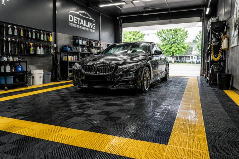 Commercial grade non-slip waterproof PVC car wash mats laid out in an auto detailing bay