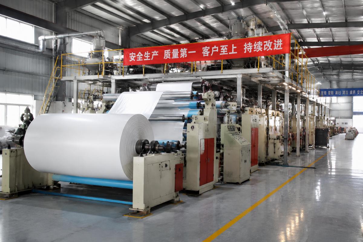Production line of acid and alkali resistant PVC fabric at a Chinese manufacturing facility