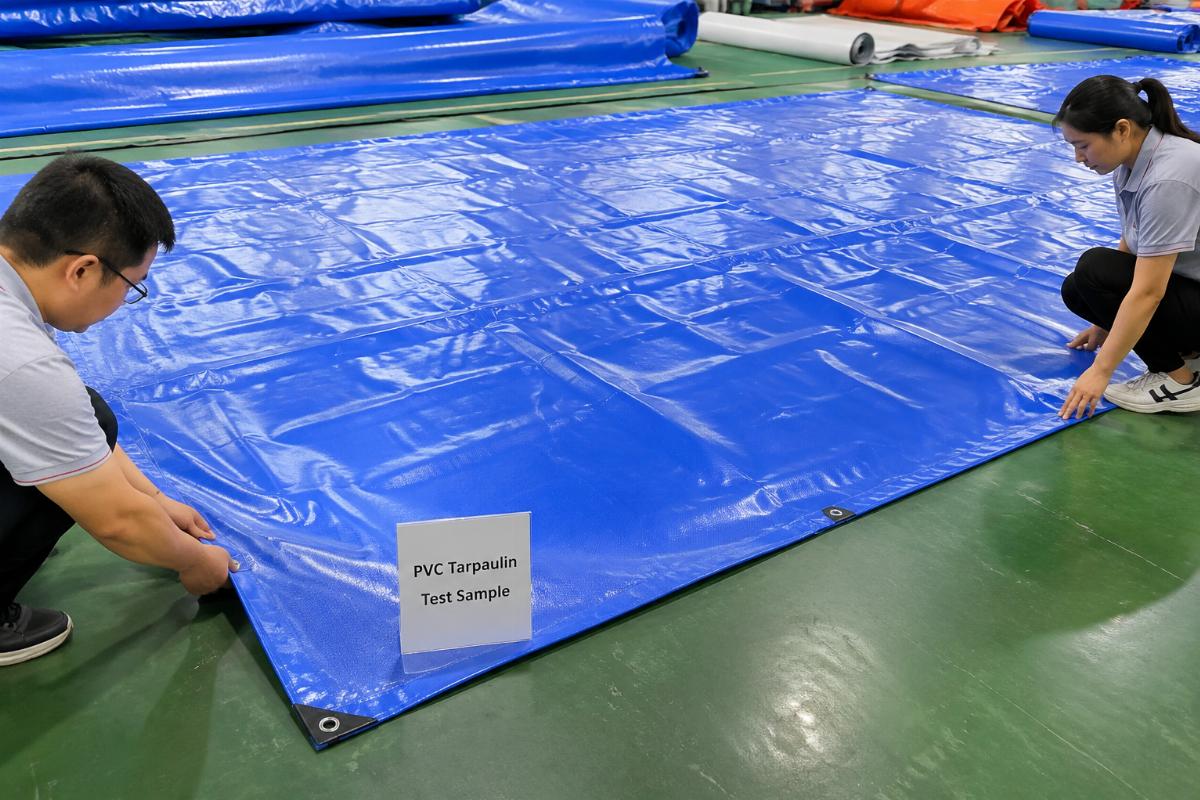 Test sample of high-performance disaster relief PVC tarpaulin laid out for quality inspection